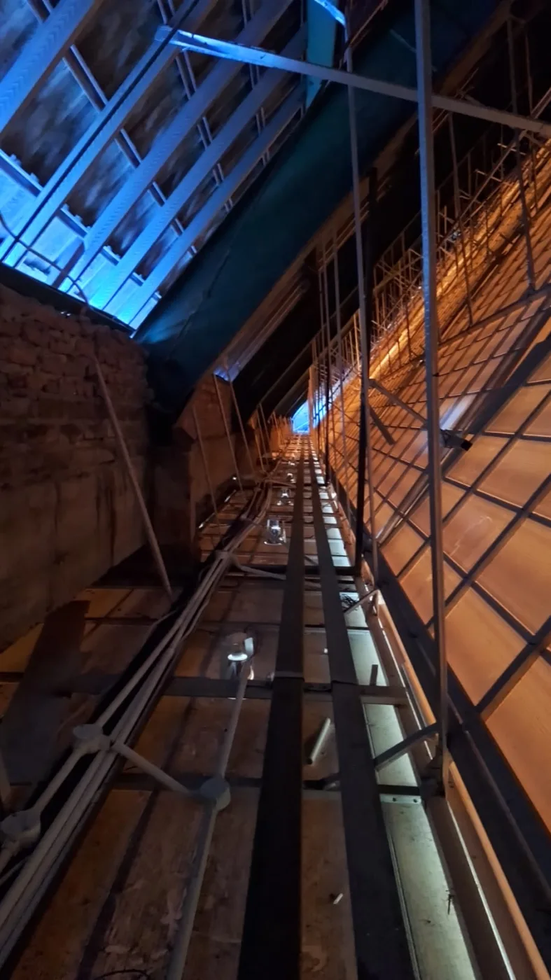 Cable runs following the roof structure, above the ceiling of the worship space.